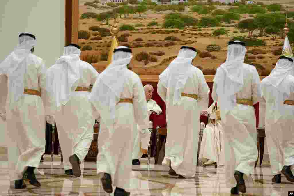 Pope Francis talks with Bahrain's King Hamad bin Isa Al Khalifa as he arrives at the Sakhir Air Base, Bahrain. Pope Francis is making the November 3-6 visit to participate in a government-sponsored conference on East-West dialogue and to minister to Bahrain's tiny Catholic community, part of his effort to pursue dialogue with the Muslim world. 
