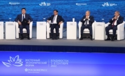 Myanmar 's military leader Min Aung Hlaing (center left), Russian President Vladimir Putin (center right) and other leaders attend the plenary session of the 2022 Eastern Economic Forum in Vladivostok on September 7, 2022. (Sergey Bobylev/Sputnik via Reuters)