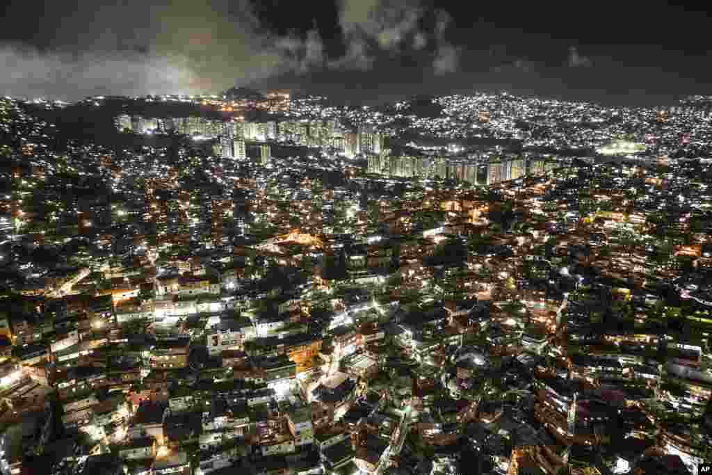 Homes cover a hill in the Petare neighborhood of Caracas, Venezuela, Nov. 15, 2022.