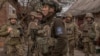 Ukrainian infantry soldiers of the 23rd Mechanized Brigade wait to head toward the front line in the Avdiivka direction, in Ukraine's Donetsk region, on April 3, 2024. (Roman Pilipey/AFP)