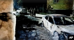 Still from a video showing FSB officers conducting a counter-terrorist operation in the republic of Dagestan, Russia, on June 24, 2024, following deadly attacks by armed militants (The National Antiterrorism Committee/via AP)
