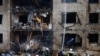 Firefighters works at the site of a residential building heavily damaged during a Russian missile attack in Kyiv on January 2, 2024. (Valentyn Ogirenko/Reuters)