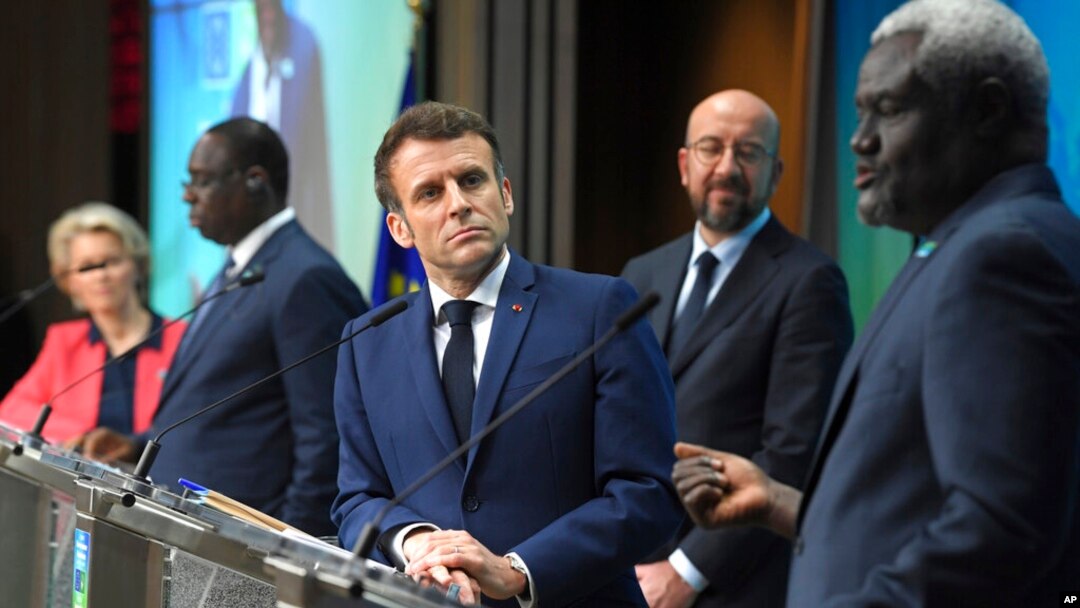 FILE - African Union Commission Chair Mahamat Moussa Faki, right, speaks during a media conference at the conclusion of an EU-AU summit in Brussels, Feb. 18, 2022.