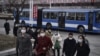 FILE - People walk along a street near the Arch of Triumph in Pyongyang, North Korea, March 25, 2024.