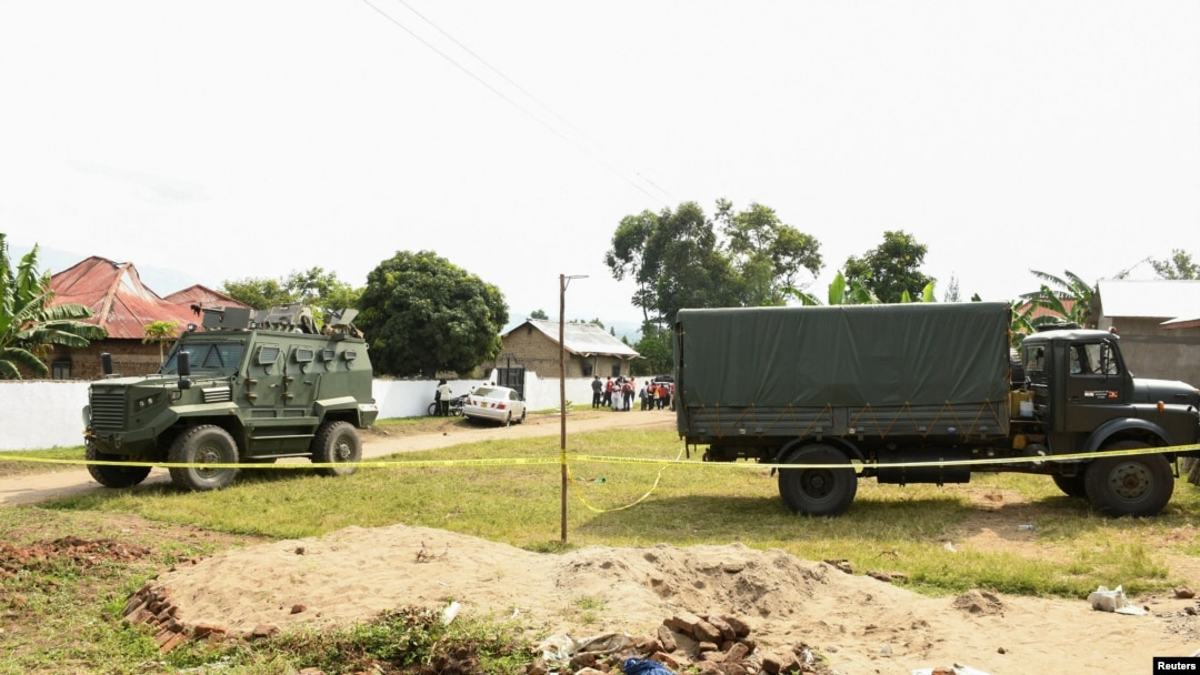 Ugandan security forces cordon the scene outside the Mpondwe Lhubirira Secondary School, after militants linked to rebel group Allied Democratic Forces (ADF) killed and abducted multiple people, in Mpondwe, western Uganda, June 17, 2023. 