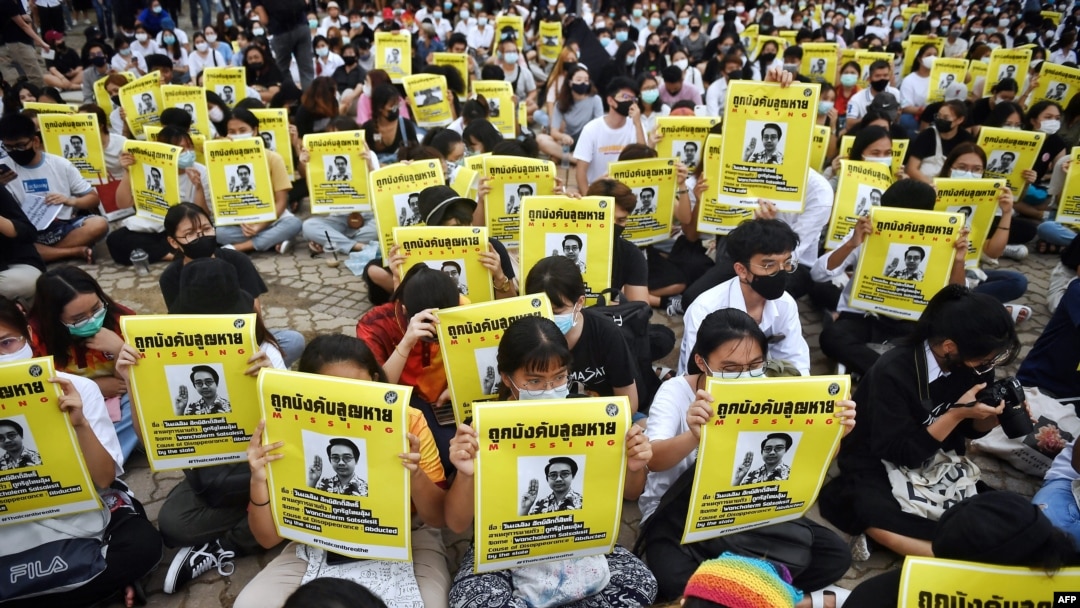 FILE - Student protesters hold posters of disappeared rights activist Wanchalearm Satsaksit at an anti-government rally at Thammasat University in Pathum Thani, north of Bangkok on Aug. 10, 2020.