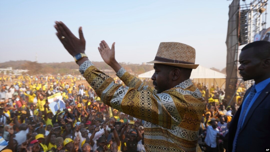 Zimbabwe's main opposition leader Nelson Chamisa is surrounded by security as he leaves a campaign rally in Harare on Aug. 21, 2023.