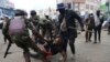 A protester is arrested in Nairobi, Kenya, Aug. 8, 2024, during a demonstration against hunger. 