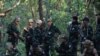 Members of the People's Defence Forces (PDF) who became guerrilla fighters after being protesters are seen on the front line in Kawkareik on December 31, 2021. (Reuters)
