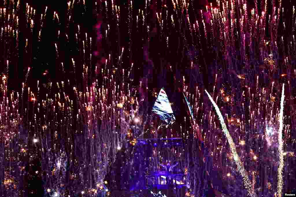 DJ Alok performs during the celebrations of the 64th anniversary of Brasilia, at the Esplanade of Ministries in Brasilia, Brazil.