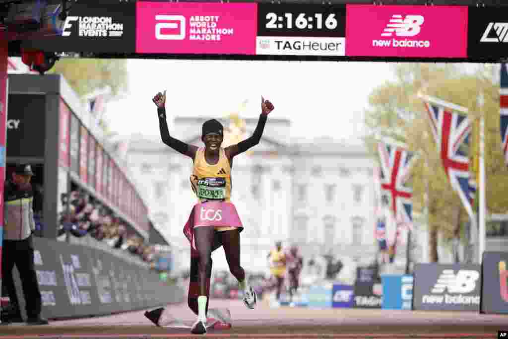 Peres Jepchirchir of Kenya crosses the finish line to win the women's race at the London Marathon in London.