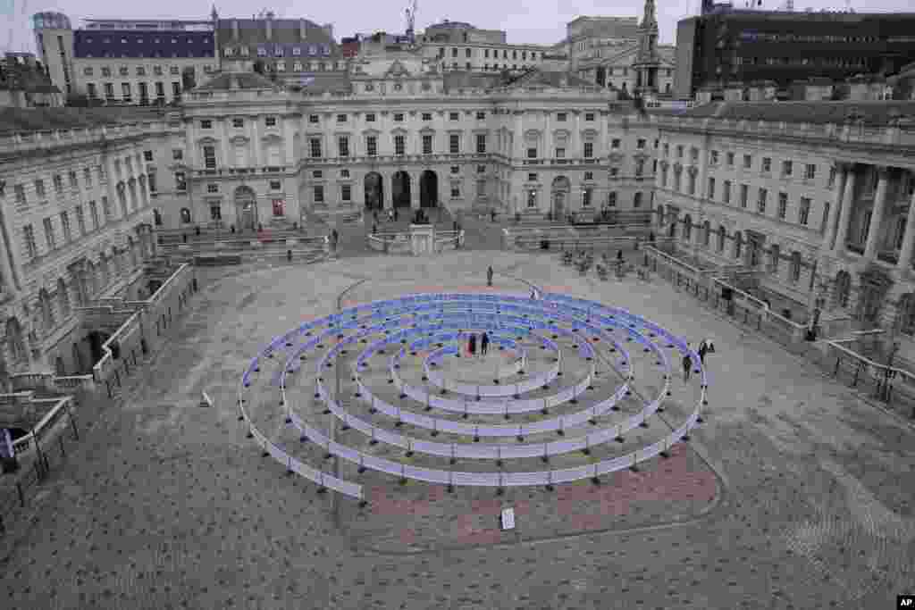 A work entitled &#39;Whorled (Here After Here After Here)&#39; by Indian artist Jitish KallatIn, standing in the center, at Somerset House in London.