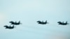 FILE - Slovak Air Force MiG-29s fly during an airshow in Malacky, Slovakia, on Aug. 27, 2022. Slovakia has delivered the remaining nine of the 13 Soviet-era MiG-29 fighter jets it pledged to Ukraine, Slovak officials said on April 17, 2023.