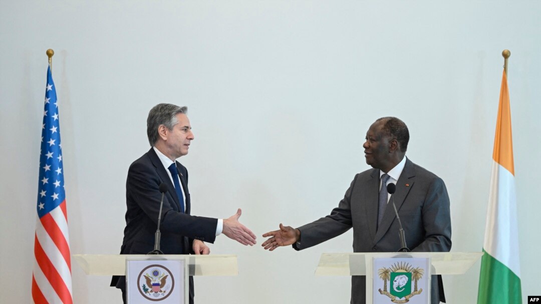 US Secretary of State Antony Blinken and President of Ivory Coast Alassane Ouattara shake hands after they delivered remarks following their meeting at the Residence of President in Abidjan, Jan. 23, 2024. 