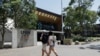 FILE - Students walk around the University of New South Wales campus in Sydney, Australia, Dec. 1, 2020. 