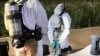  South Korean military officers check unidentified objects believed to be North Korean trash from balloons that crossed the inter-Korea border, on a street in Seoul, between the night of June 1 and 2, 2024. (South Korean Defence Ministry/AFP)