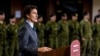 FILE - Canada's Prime Minister Justin Trudeau announces that Canada will send more military equipment and impose additional sanctions on Russian officials on the one-year anniversary of Russia's invasion of Ukraine, at Fort York Armoury in Toronto, Canada, Feb. 24, 2023.