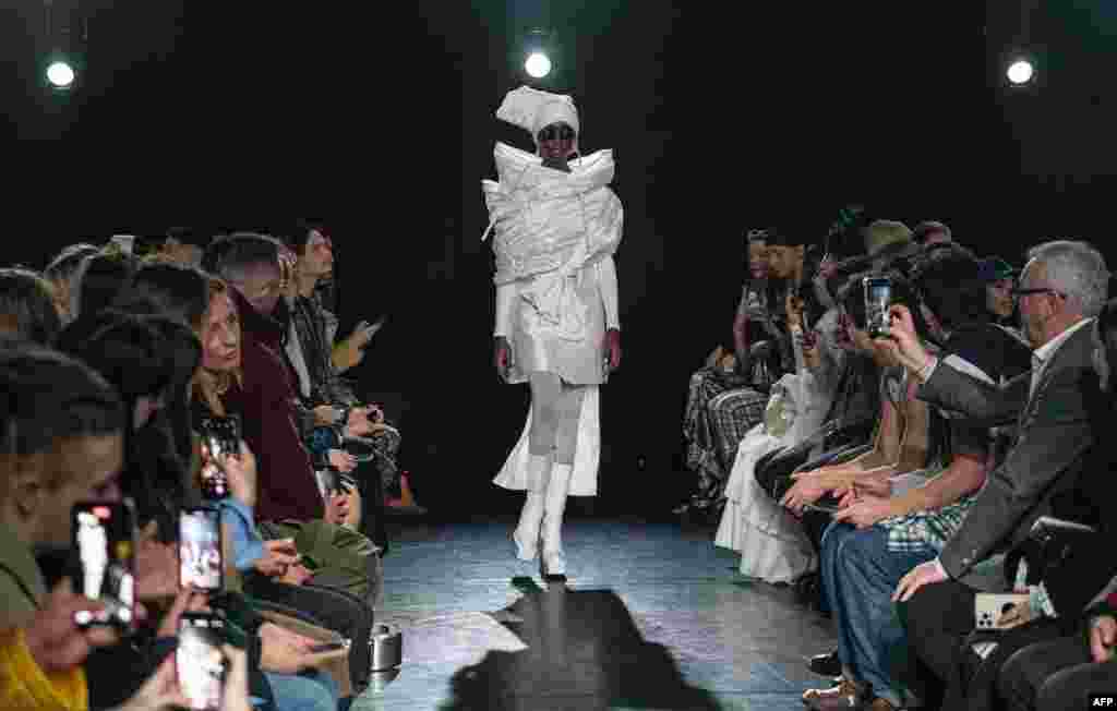 A model presents a creation for British designer Edward Crutchley during the catwalk show for his Autumn/Winter 2023 collection on the opening day of London Fashion Week.