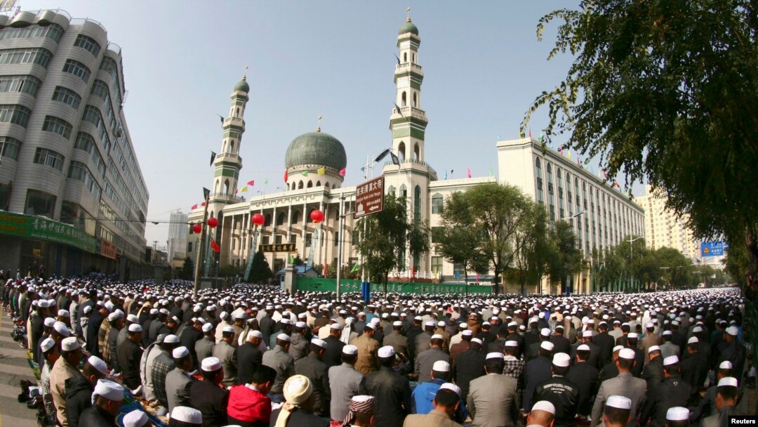 FILE - Muslims attend a prayer session at Dongguan Mosque during Eid al-Fitr in Xining, Qinghai province, Sept. 9, 2010. It was among the most famous places of worship to undergo Sinicization, its distinctive domes and minarets toppled in 2021.