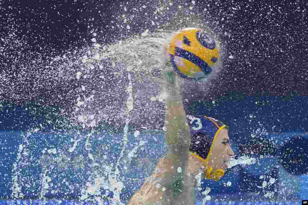 Spain's Alvaro Granados Ortega shoots to score during a men's water polo Group B preliminary match between Serbia and Spain, at the 2024 Summer Olympics, Aug. 1, 2024, in Saint-Denis, France.