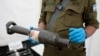 The Israeli military presents weapons and military equipment they say were used by Hamas militants from the Gaza Strip during the deadly October 7 attack, at the Tzrifin military base in central Israel, on Nov. 20, 2023. (Ammar Awad/Reuters)
