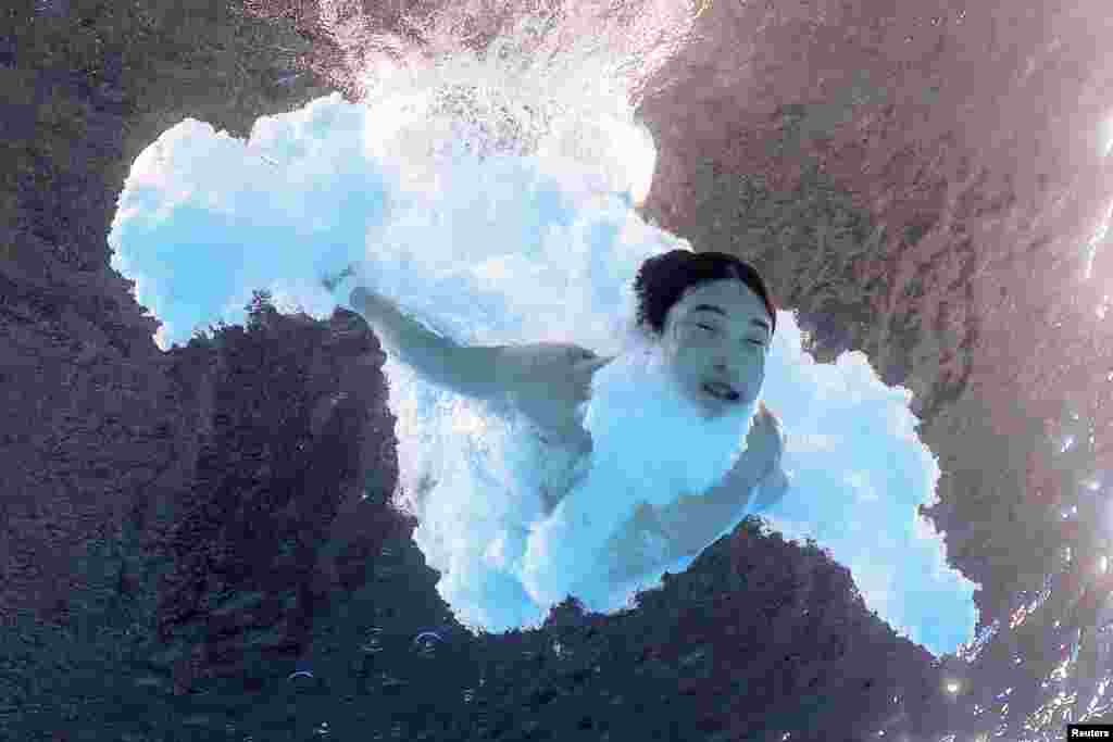 Woo Haram of South Korea competes in the men's 3m springboard final diving race at Aquatics Center in Saint-Denis, France, during the Paris 2024 Olympics.