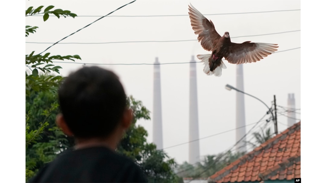 Steams spew from the chimneys of a coal power plant, in Cilegon, Banten province, Indonesia, on Oct. 3, 2023.