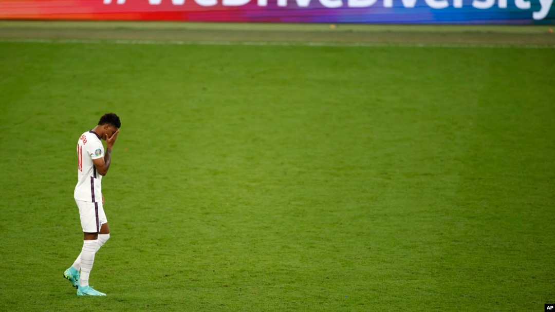 England's Marcus Rashford reacts after missing a penalty in a shootout against Italy at the Euro 2020 soccer championship final at Wembley stadium in London, Sunday, July 11, 2021. (John Sibley/Pool Photo via AP, File)