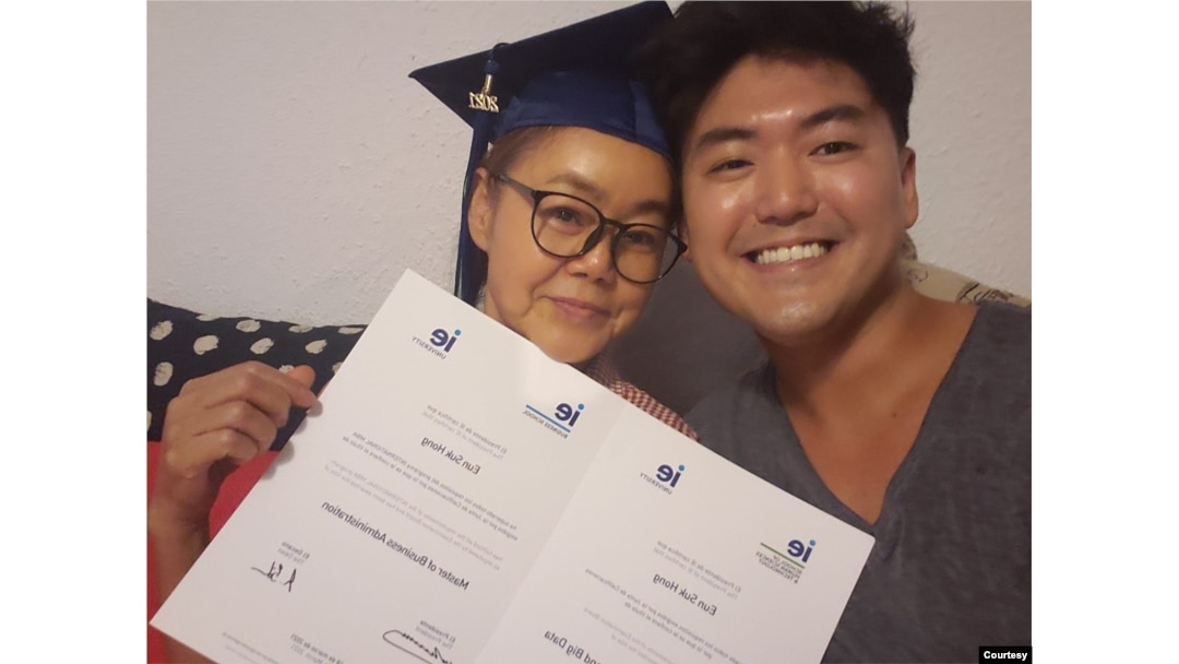 Eun Suk “Jason” Hong, a former DACA recipient, poses with his mother in Spain when he graduated with a master's degree in business analytics and big data. (Photo courtesy of Eun Suk Hong)
