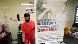FILE - A Dallas County Health and Human Services nurse completes paperwork after administering a Pfizer COVID-19 vaccine at a county-run vaccination site in Dallas, Aug. 26, 2021.