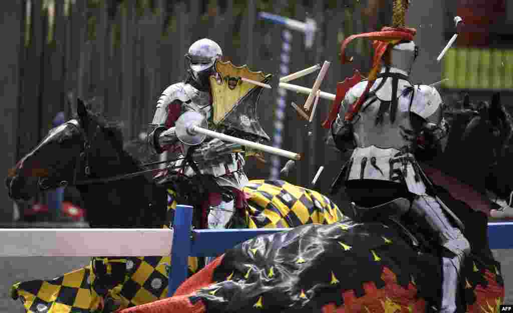 England's Andrew Deane (L) jousts with Australia's Phil Leitch (R) during the inaugural "Ashes" jousting tournament between Australia and England at the Kryal Castle in Leigh Creek, some 100 kms west of Melbourne, Australia.