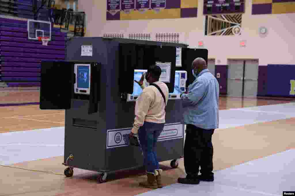 Voters cast their ballots at the Thurgood Marshall High School polling station during the 2022 U.S. midterm election in Dayton, Ohio, Nov. 8, 2022.