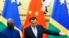 FILE - Solomon Islands Prime Minister Manasseh Sogavare, left, and Chinese Premier Li Keqiang attend a signing ceremony at the Great Hall of the People in Beijing, Oct. 9, 2019.