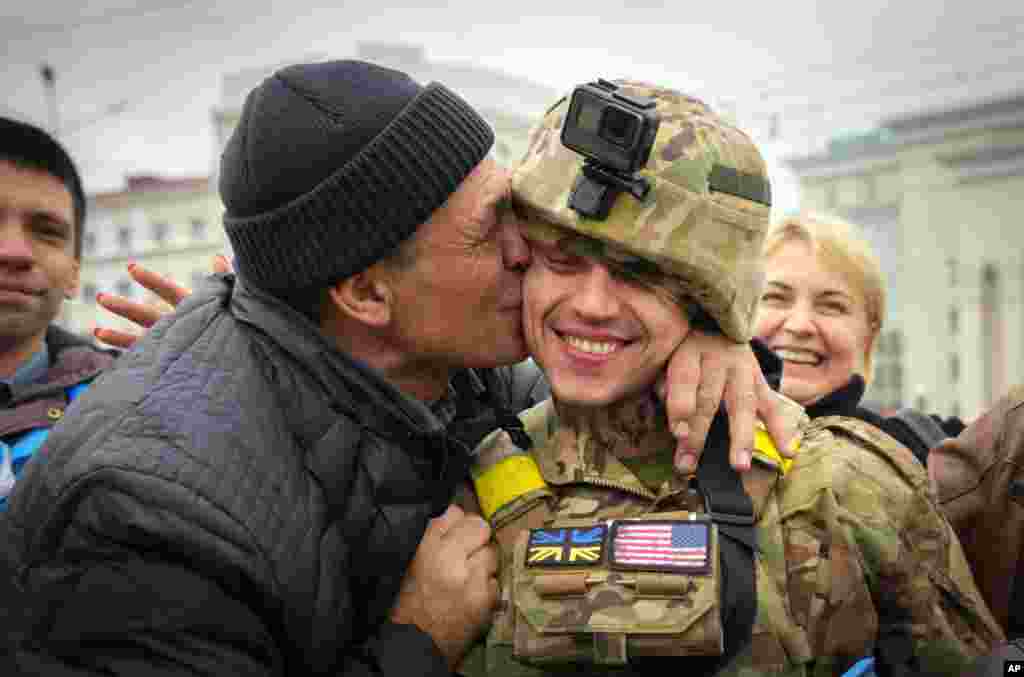 A Kherson resident kisses a Ukrainian soldier in central Kherson. The Russian retreat from Kherson marked a triumphant milestone in Ukraine's pushback against Moscow's invasion almost nine months ago.