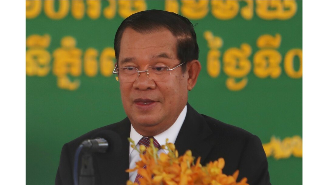 FILE - Cambodian Prime Minister Hun Sen delivers a speech at Phnom Penh International Airport, in Phnom Penh, Cambodia, Feb. 7, 2021.