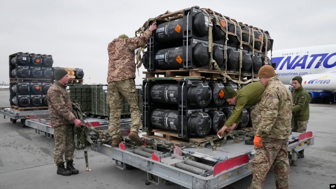 Ukrainian servicemen unload Javelin anti-tank missiles, delivered as part of U.S. security assistance to Ukraine, at Boryspil airport, outside Kyiv, Ukraine, Feb. 11, 2022.