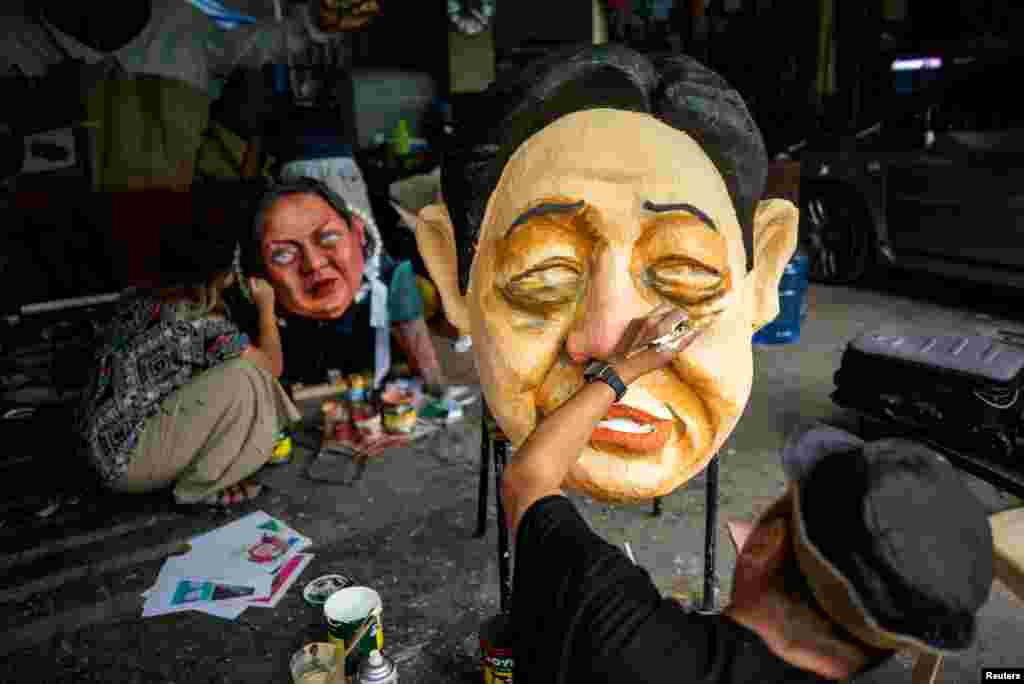 Filipino activists paint effigies depicting Philippine President Ferdinand Marcos Jr. and Philippine Vice President Sara Vicenta Zimmerman Duterte-Carpio, ahead of Human Rights Day, in Quezon City, Metro Manila, Philippines.