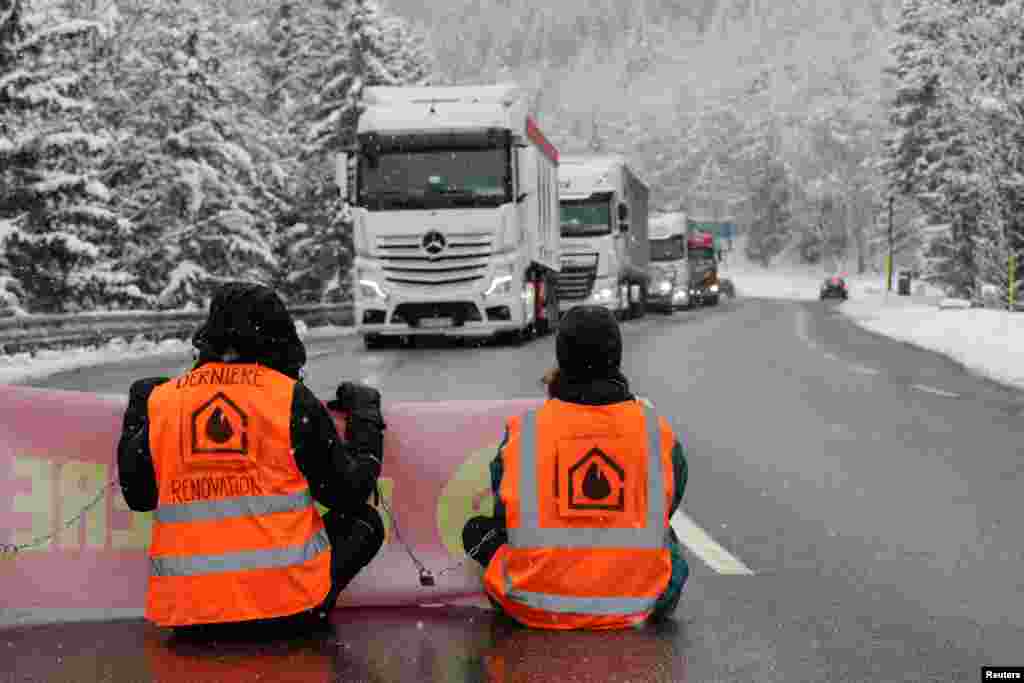Climate activists from the group Derniere Renovation block the access road to the Mont-Blanc tunnel to protest the lack of international action at the COP15, the two-week U.N. Biodiversity summit, in Chamonix, France.