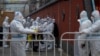 China Reports Another One-Day COVID Case Record, Tightens Curbs
