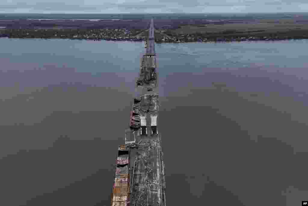 General view of the damaged Antonivsky Bridge in Kherson, Ukraine. The bridge, the main crossing point over the Dnipro river in Kherson, was destroyed by Russian troops in earlier November, after Kremlin's forces withdrew from the southern city. 