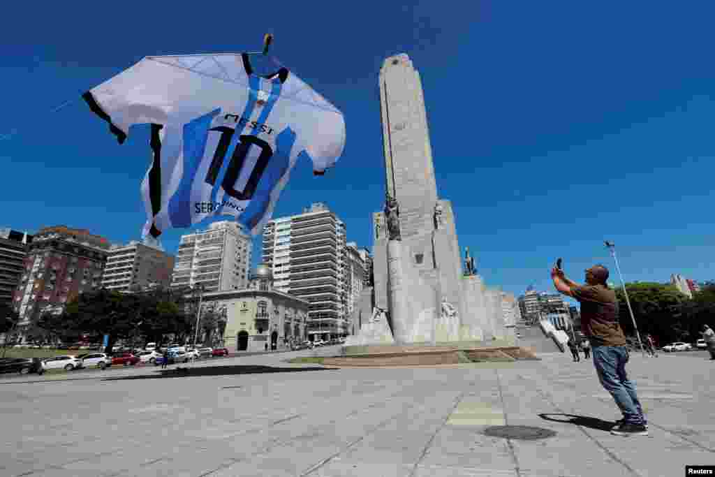 An 18-meter-long Argentina shirt featuring soccer star Lionel Messi's surname is displayed at the Monumento a la Bandera, in Rosario, Argentina.