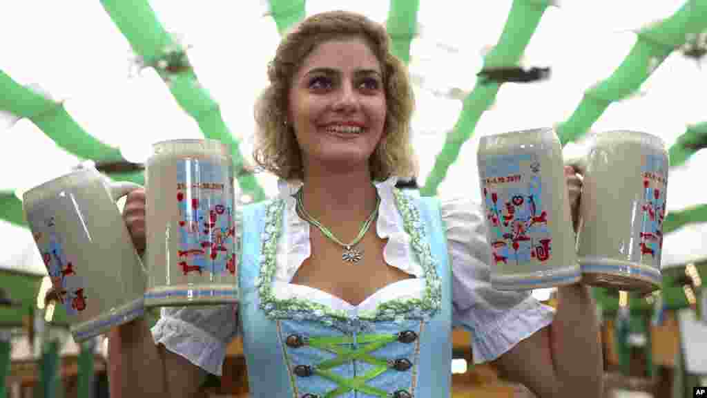 Elena poses with the new official Oktoberfest 2019 beer mugs in Munich, Germany.