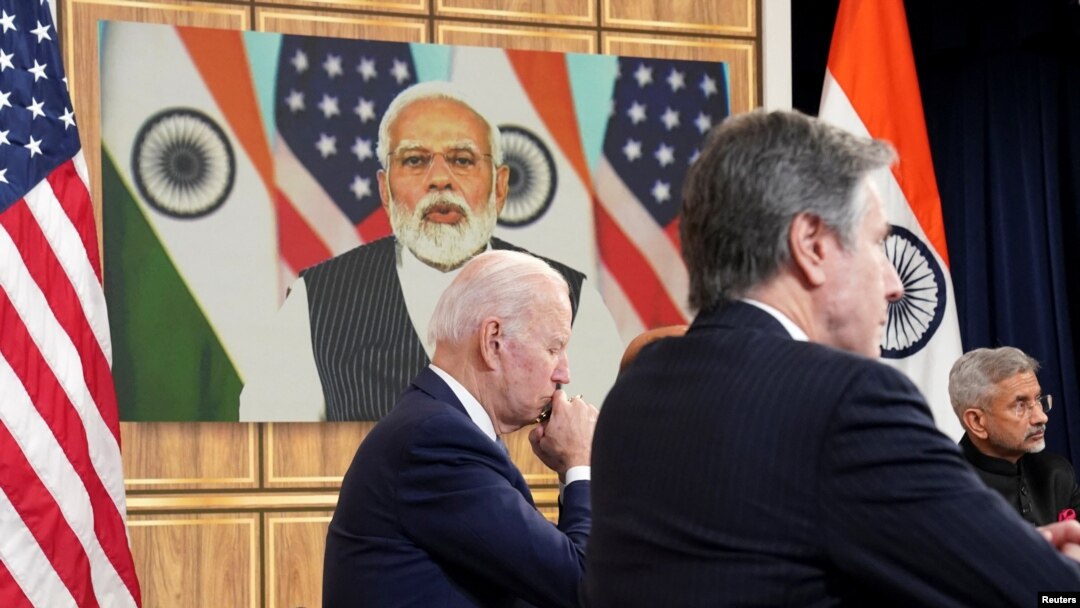 U.S. President Joe Biden, seated with Secretary of State Antony Blinken and India's Foreign Minister Subrahmanyam Jaishankar holds a videoconference with India's Prime Minister Narendra Modi to discuss Russia's war with Ukraine from the White House, Apr. 