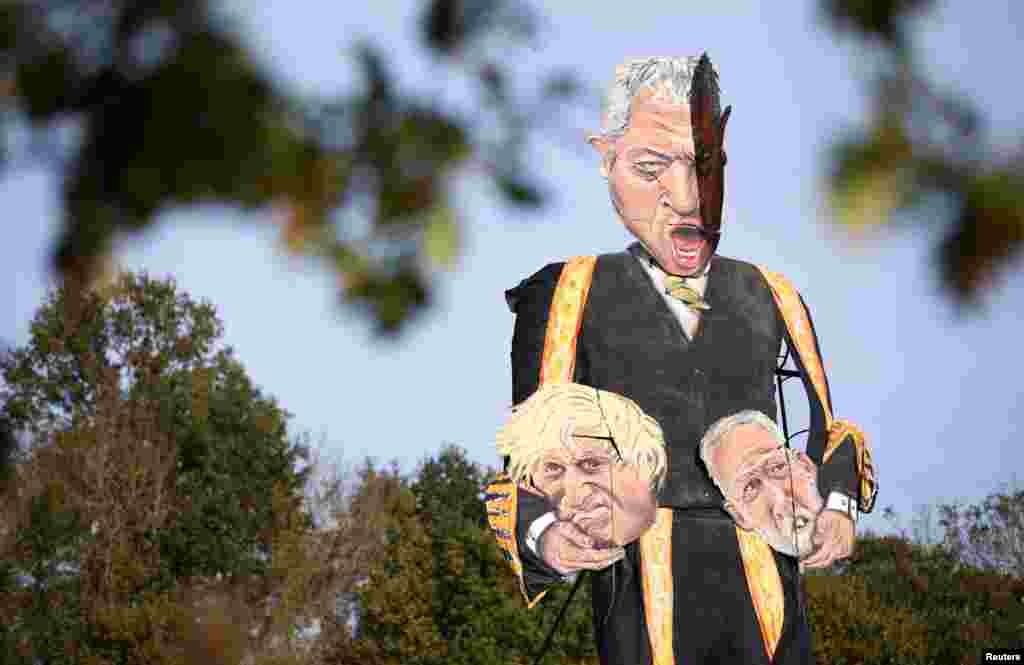 The 11-meter effigy of Britain's Speaker of the House of Commons John Bercow holding the heads of Prime Minister Boris Johnson and Labour Party leader Jeremy Corbyn is unveiled in Edenbridge, Britain.