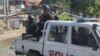 Haiti swears in new PM as gangs shoot at flight landing at airport