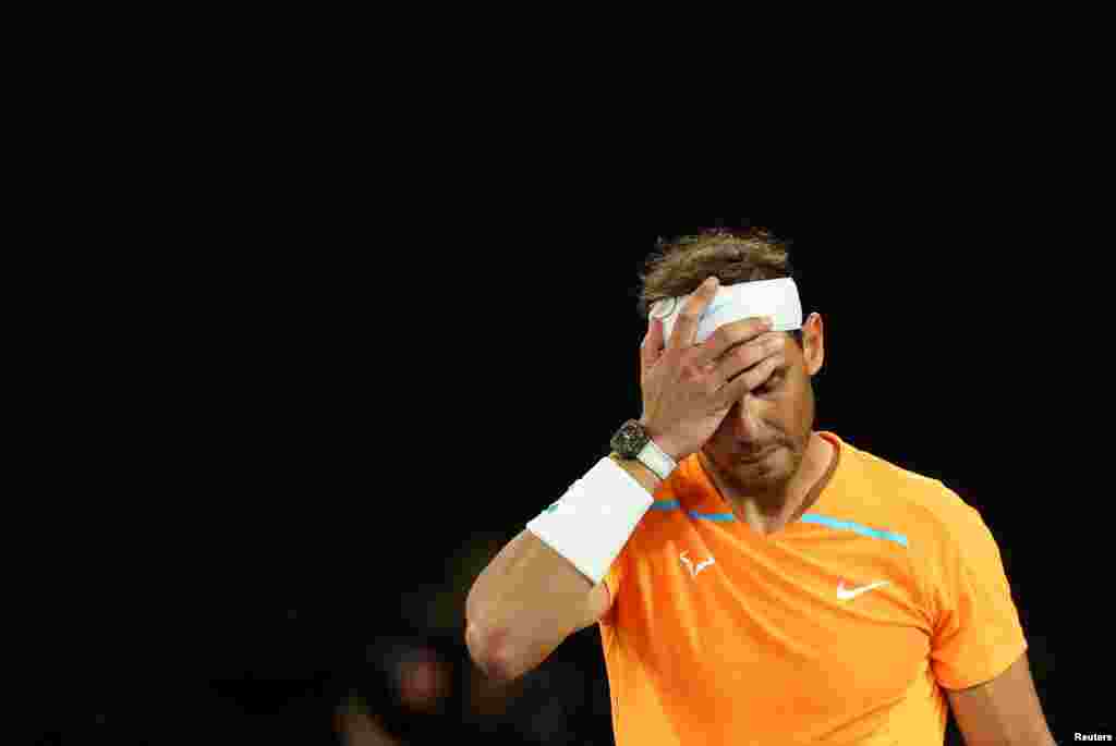 Spain's Rafael Nadal looks dejected after losing his second round match against Mackenzie Mcdonald of the U.S. during the Australia Open tennis championship in Melbourne Park, Melbourne.