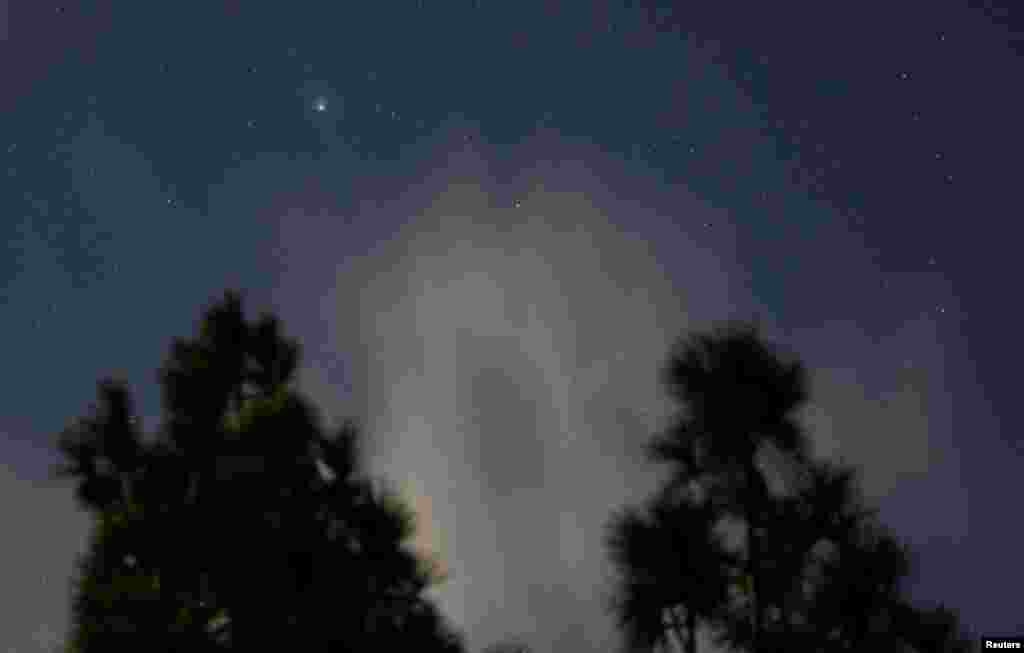 A green comet named Comet C/2022 E3 (ZTF) is seen from the Pico de las Nieves, in the island of Gran Canaria, Spain. The comet last passed by our planet about 50,000 years ago.