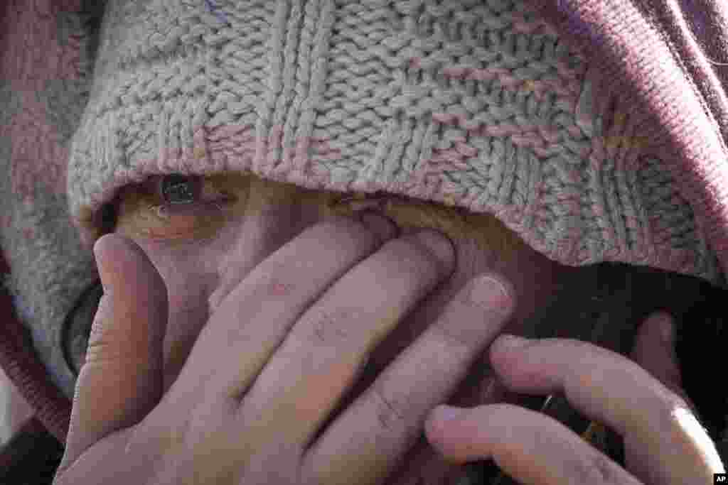 Masha Fesenko, from Kyiv, arrives at the border crossing in Medyka, Poland, March 8, 2022. Russia's invasion of Ukraine has set off the largest mass migration in Europe in decades, with more than 1.5 million people having crossed from Ukraine into neighboring countries. 