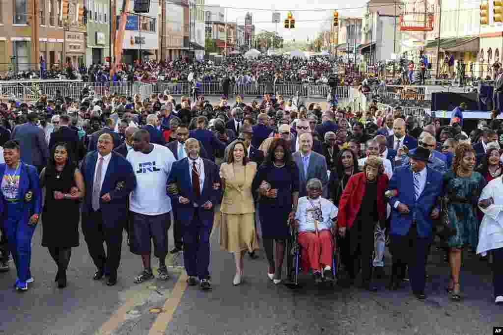 Vice President Kamala Harris marches on the Edmund Pettus Bridge after speaking in Selma, Alabama, on the anniversary of "Bloody Sunday," a landmark event of the civil rights movement, March 6, 2022.