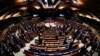 Ukrainian Prime Minister Denys Shmyhal receives standing ovation from Members of the Parliamentary Assembly of the Council of Europe after his address via videolink, in an extraordinary session to discuss Russia's invasion of Ukraine, in Strasbourg, France, March 14, 2022.